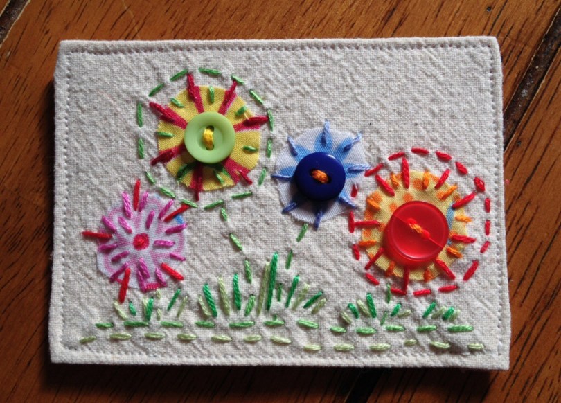 Fabric ATC by patch. Hand embroidered spring flowers.